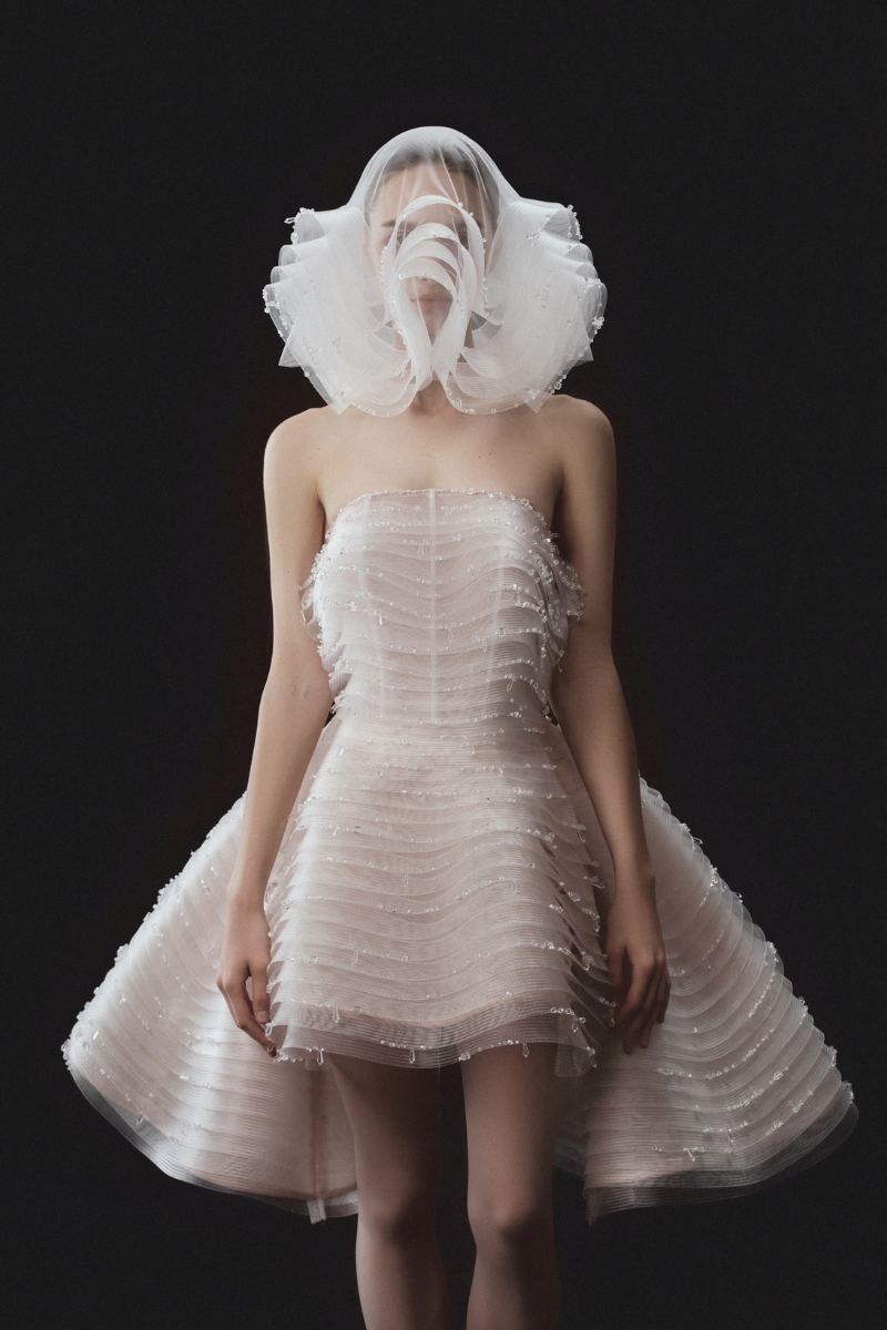 SLEEVELESS BEADED AND LAYERED BUSTIER DRESS WITH MATCHING OVERSKIRT