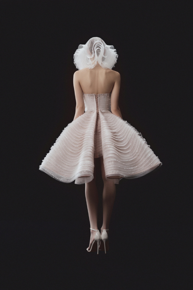 SLEEVELESS BEADED AND LAYERED BUSTIER DRESS WITH MATCHING OVERSKIRT